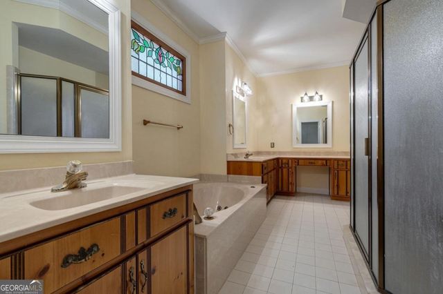 a living room with furniture a fireplace and a large window