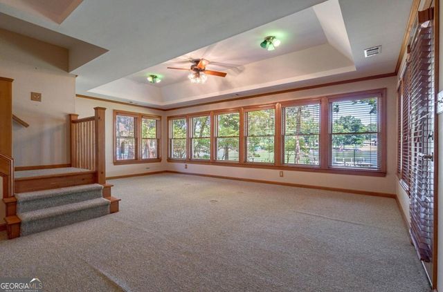 a view of empty room with wooden walls