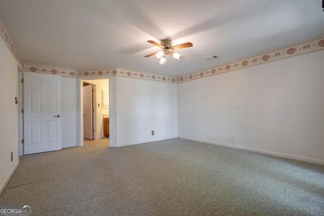 a view of a tree in the middle of a yard