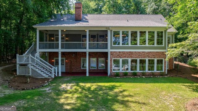 a view of outdoor space with sliding door and wooden floor