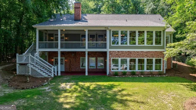 a view of outdoor space with sliding door and wooden floor