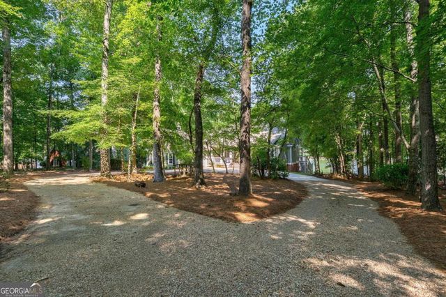 a view of a hallway view with wooden floor and staircase