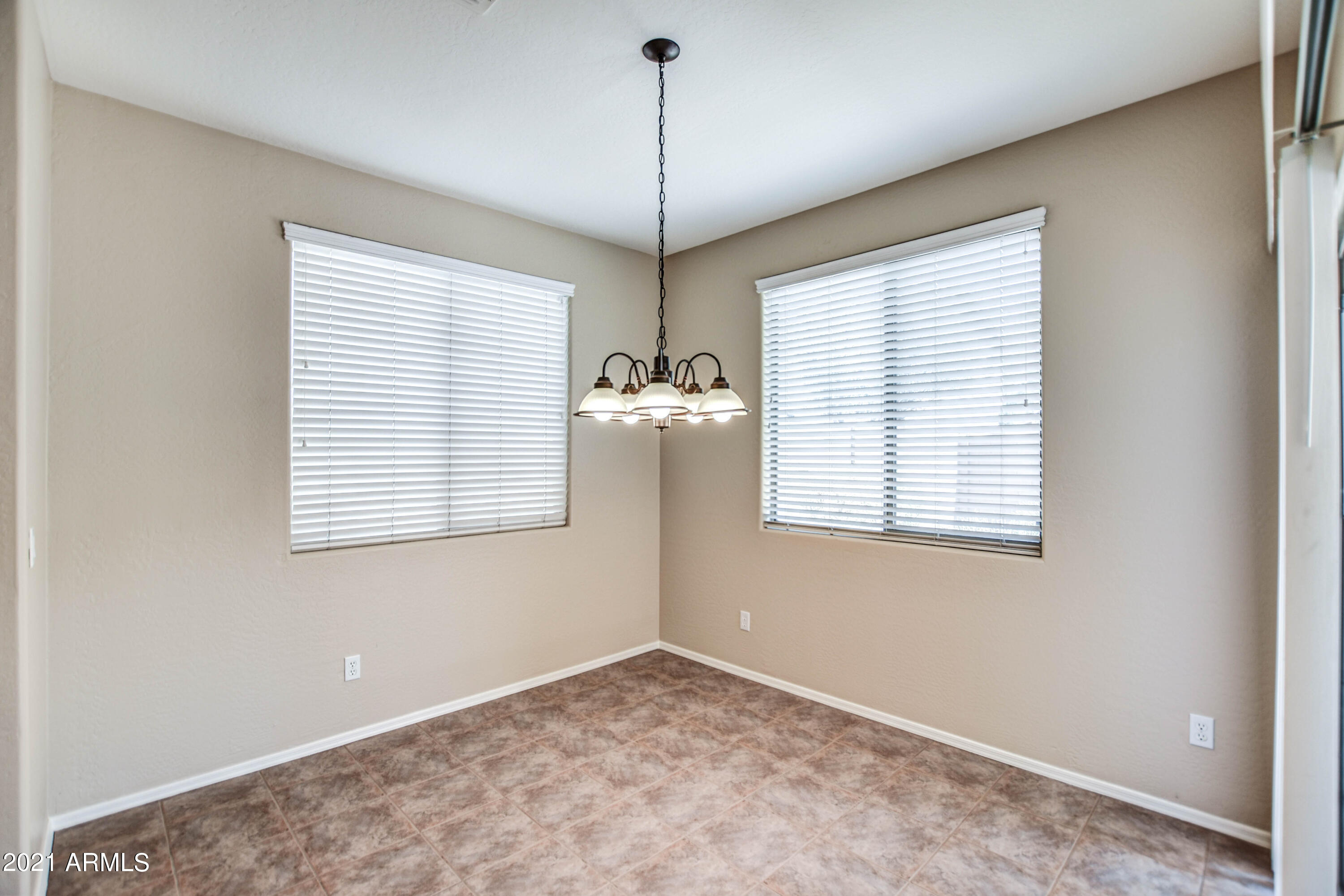3787 East Chickadee Road Gilbert, AZ 85297 - Photo 6 of 41 a view of an empty room with a window