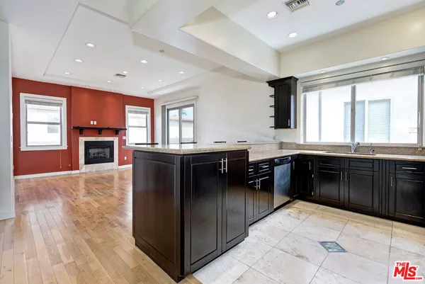 a kitchen with stainless steel appliances granite countertop a stove and a sink