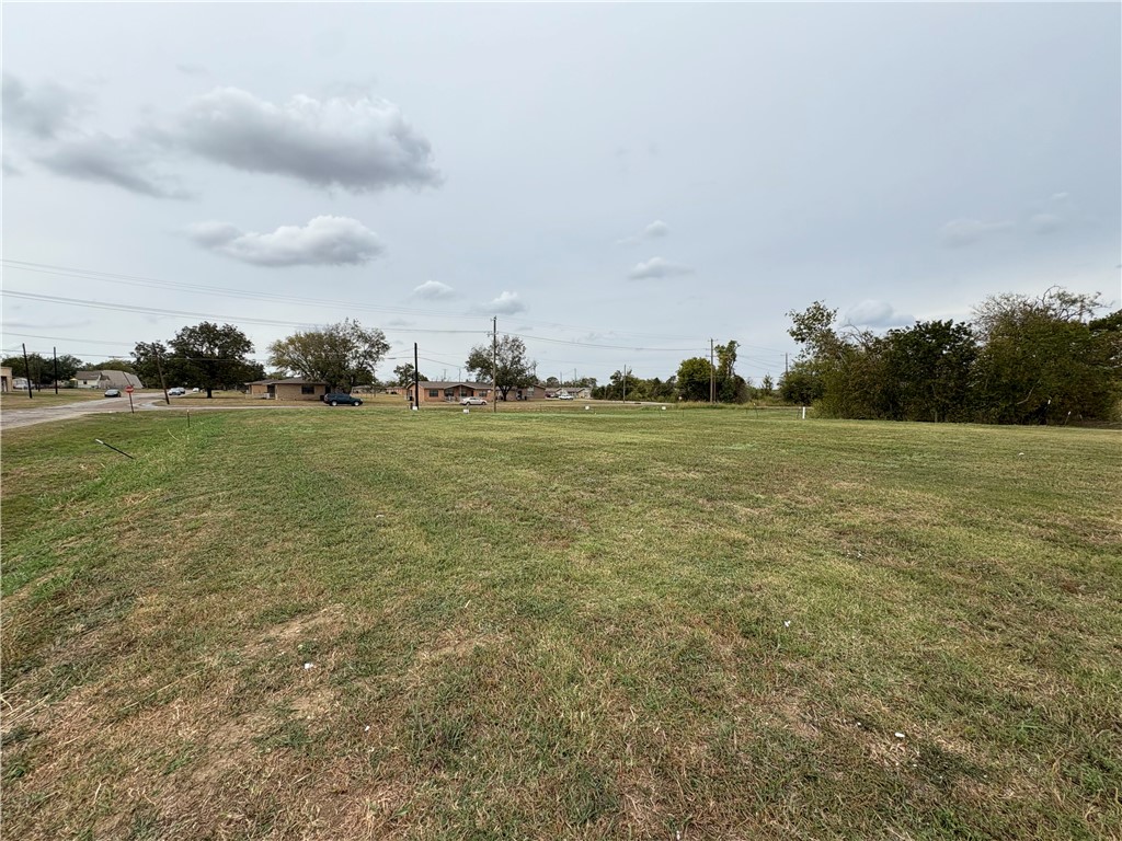 Tbd Tbd Sabine Groesbeck, TX 76642 - Photo 2 of 9 a view of a field with an trees in front of it