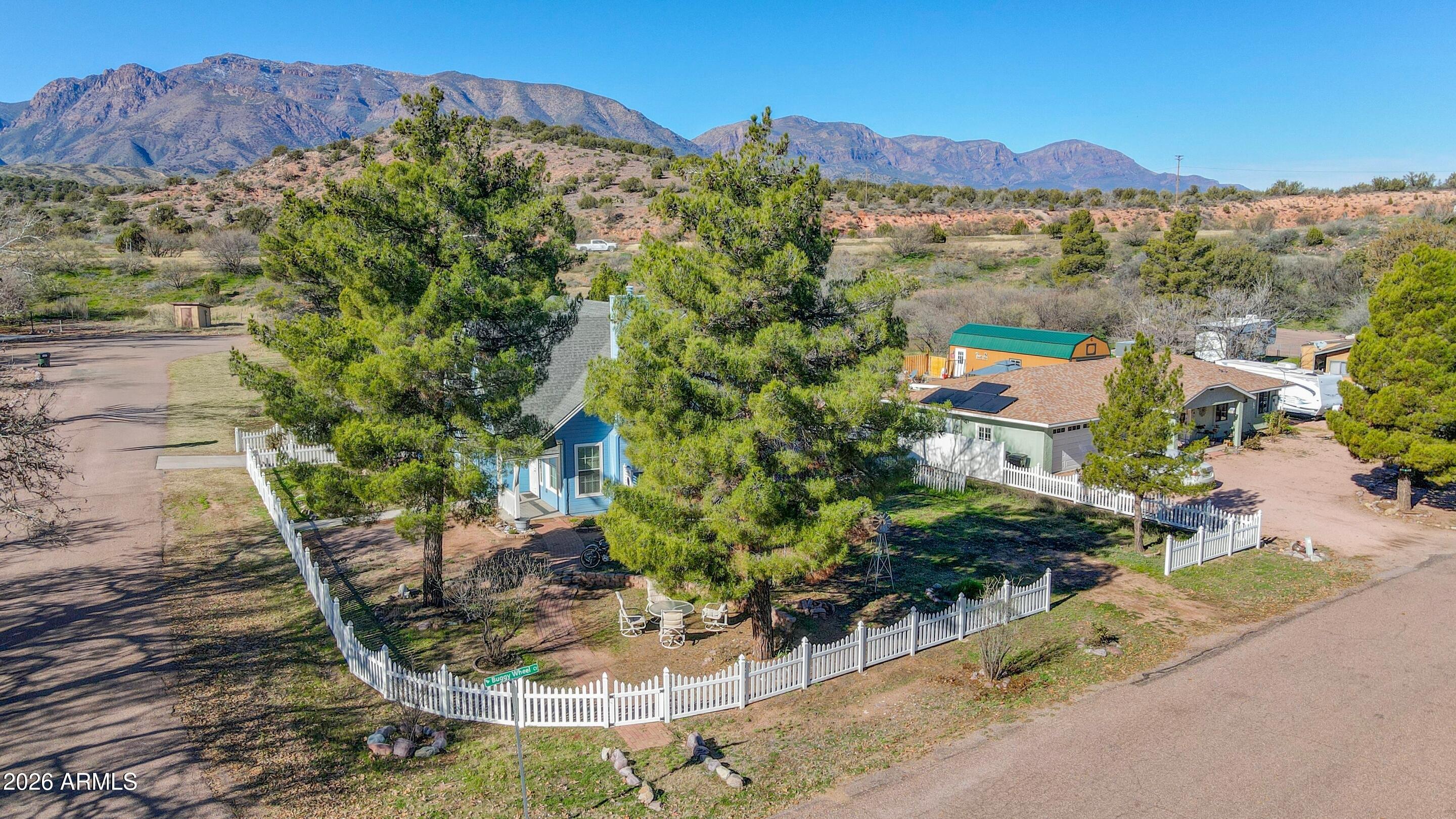 228 Windmill Road Payson, AZ 85541 - Photo 41 of 42 a view of a house with a yard and a wooden fence