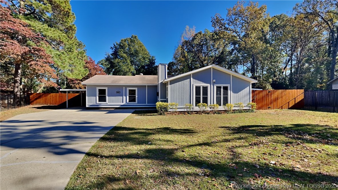 a view of a house with swimming pool and sitting area