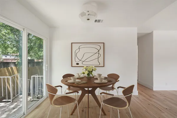 a view of a dining room with furniture window and outside view