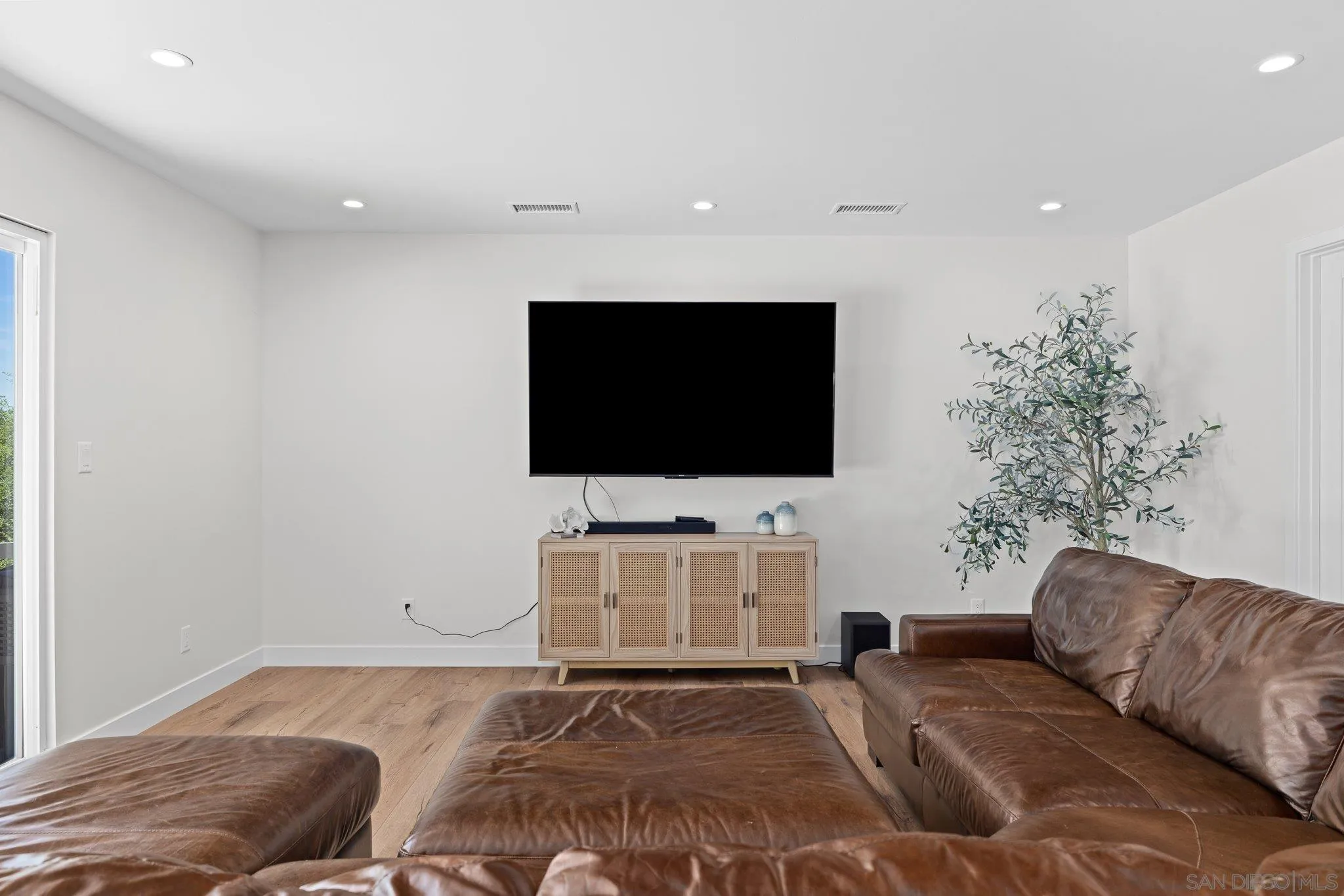 2686 Via Viejas Alpine, CA 91901 - Photo 15 of 55 a living room with a flat screen tv and a couch