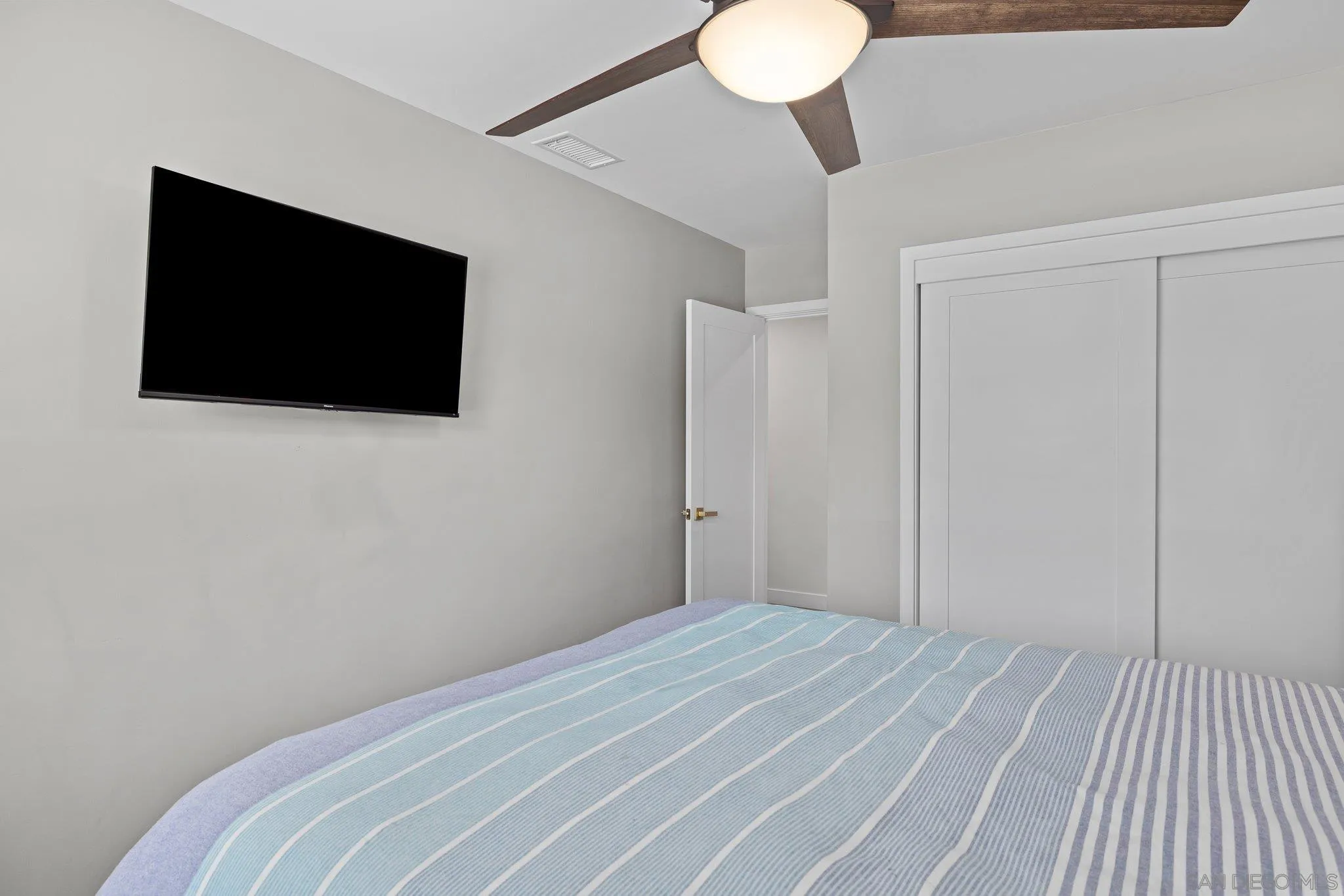 2686 Via Viejas Alpine, CA 91901 - Photo 26 of 55 a bedroom with a bed and a flat screen tv