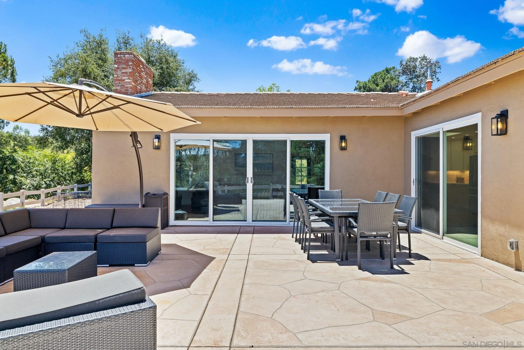 2686 Via Viejas Alpine, CA 91901 - Photo 32 of 55 a view of a patio with table and chairs potted plants with wooden fence