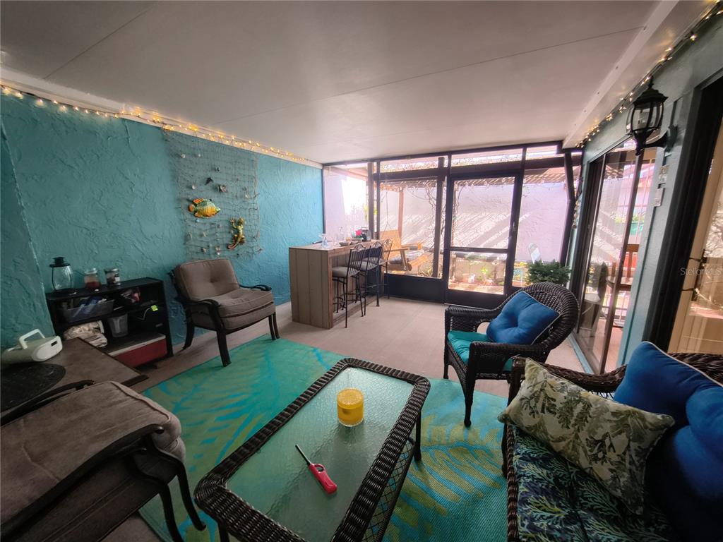 7519 Clanton Trail Hudson, FL 34667 - Photo 29 of 83 a living room with furniture and a large window