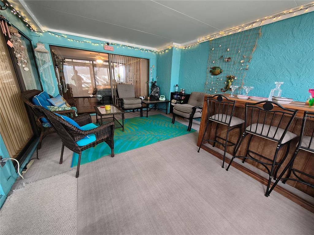 7519 Clanton Trail Hudson, FL 34667 - Photo 31 of 83 a living room with furniture and a large window