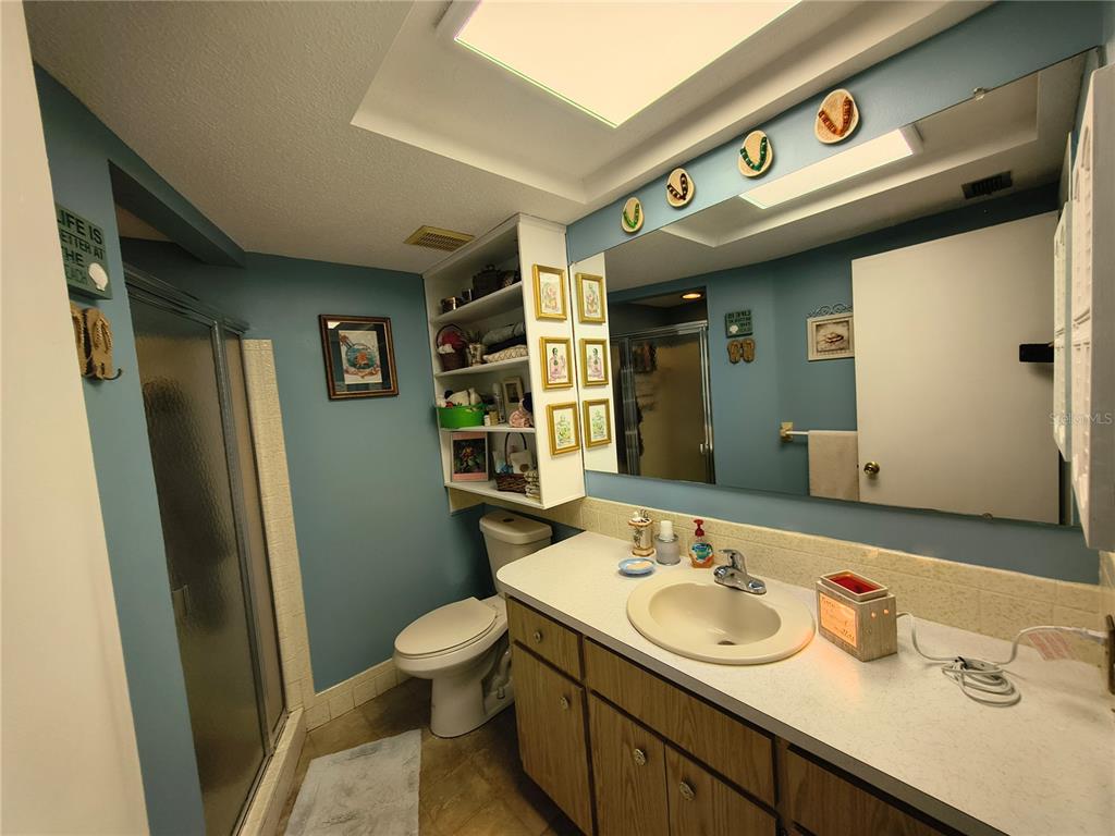 7519 Clanton Trail Hudson, FL 34667 - Photo 39 of 83 a bathroom with a sink and a mirror