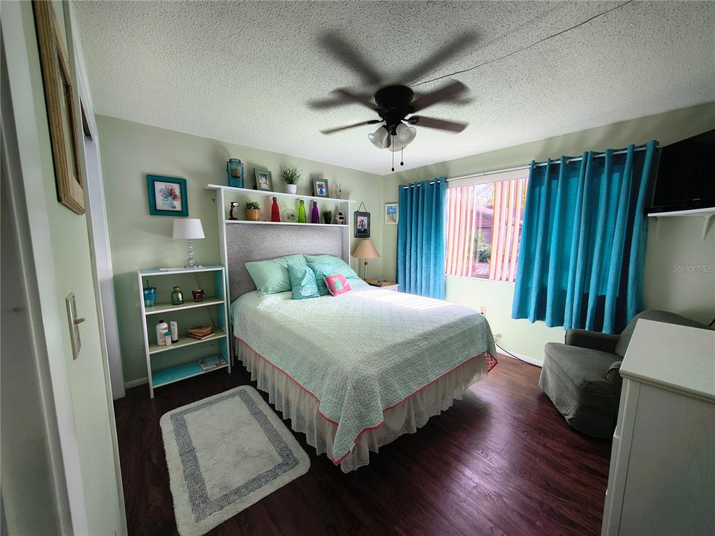 7519 Clanton Trail Hudson, FL 34667 - Photo 41 of 83 a bedroom with a bed and a large window