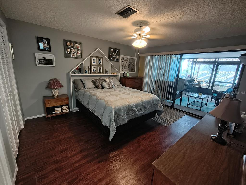 7519 Clanton Trail Hudson, FL 34667 - Photo 46 of 83 a bedroom with a bed window and a desk