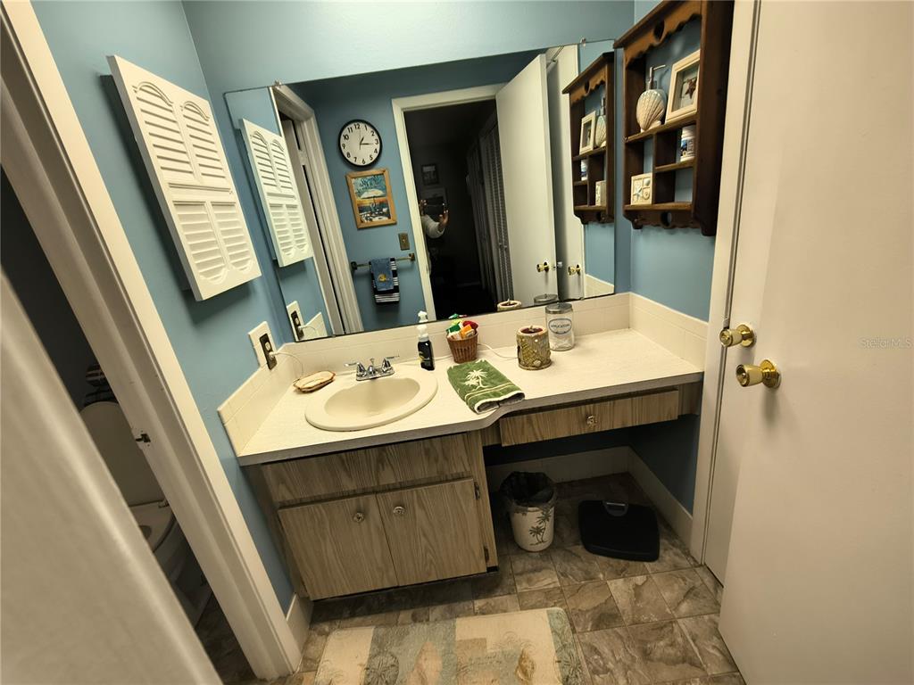 7519 Clanton Trail Hudson, FL 34667 - Photo 47 of 83 a bathroom with a sink a toilet and a mirror