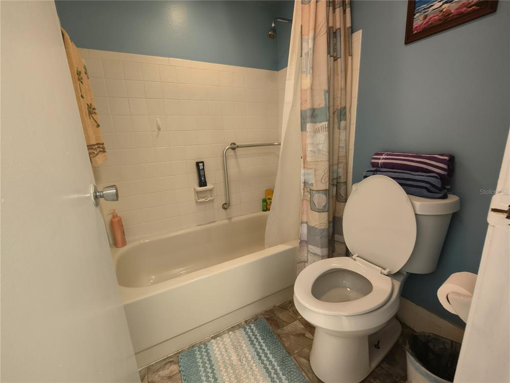 7519 Clanton Trail Hudson, FL 34667 - Photo 48 of 83 a white toilet sitting next to a bath tub