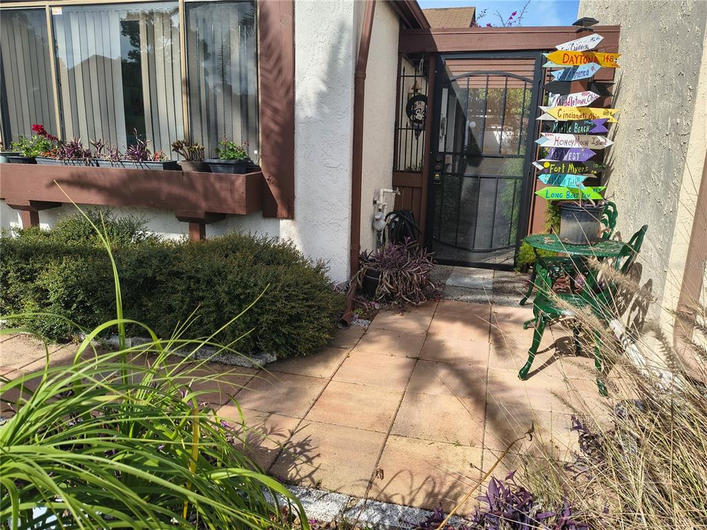 7519 Clanton Trail Hudson, FL 34667 - Photo 9 of 83 a backyard of a house with lots of green space and glass windows