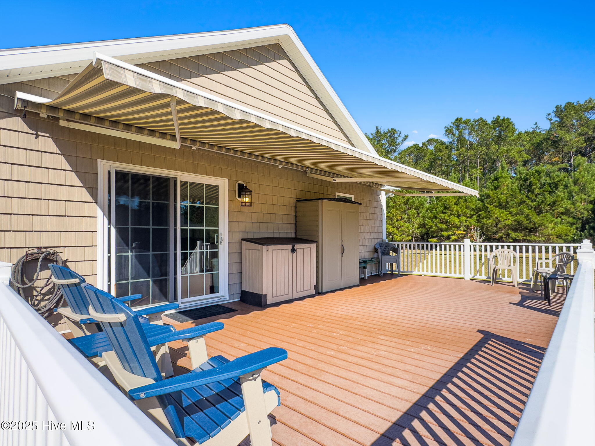 2580 Ash Little River Road Northwest Ash, NC 28420 - Photo 12 of 33 Backyard Deck with Retractable Awning