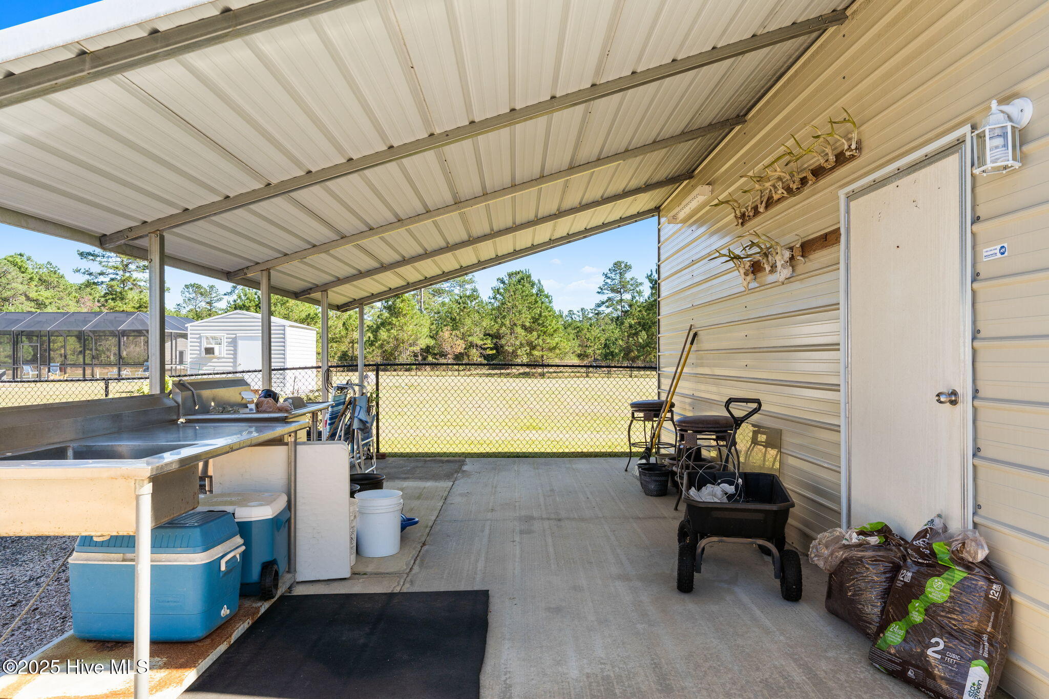 2580 Ash Little River Road Northwest Ash, NC 28420 - Photo 22 of 33 Left side garage 1with fish cleaning and game cleaning station