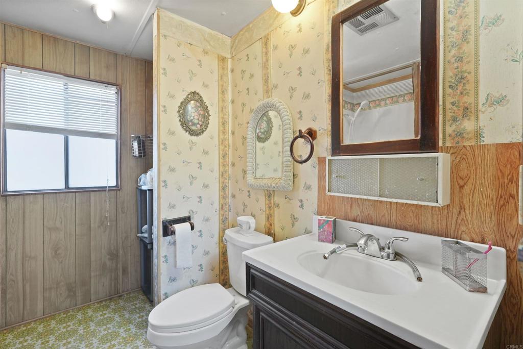40645 Sage Road Hemet, CA 92544 - Photo 13 of 70 a bathroom with a sink a toilet and shower