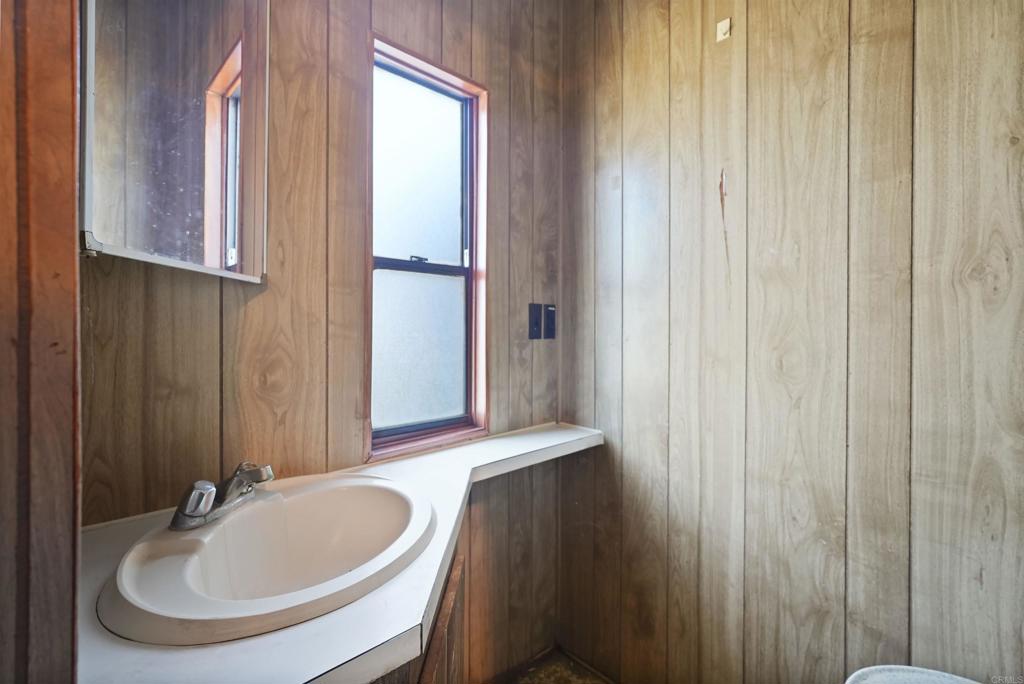 40645 Sage Road Hemet, CA 92544 - Photo 14 of 70 a bathroom with a sink and a mirror