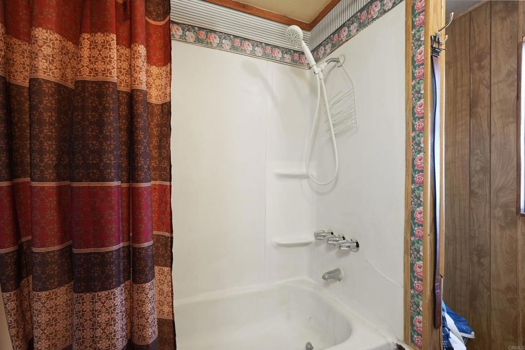 40645 Sage Road Hemet, CA 92544 - Photo 29 of 70 a bathroom with a shower and a bath tub