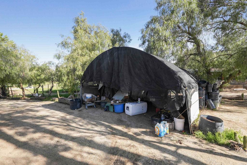 40645 Sage Road Hemet, CA 92544 - Photo 32 of 70 a view of a two sitting area with some trees in the background