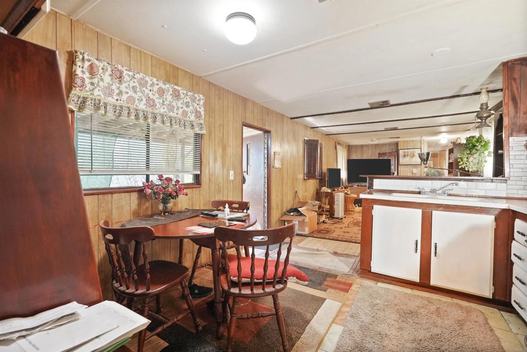 40645 Sage Road Hemet, CA 92544 - Photo 4 of 70 a view of a dining room with furniture and window