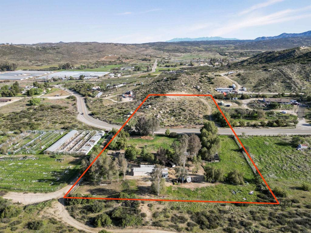 40645 Sage Road Hemet, CA 92544 - Photo 43 of 70 an aerial view of residential houses with outdoor space and trees