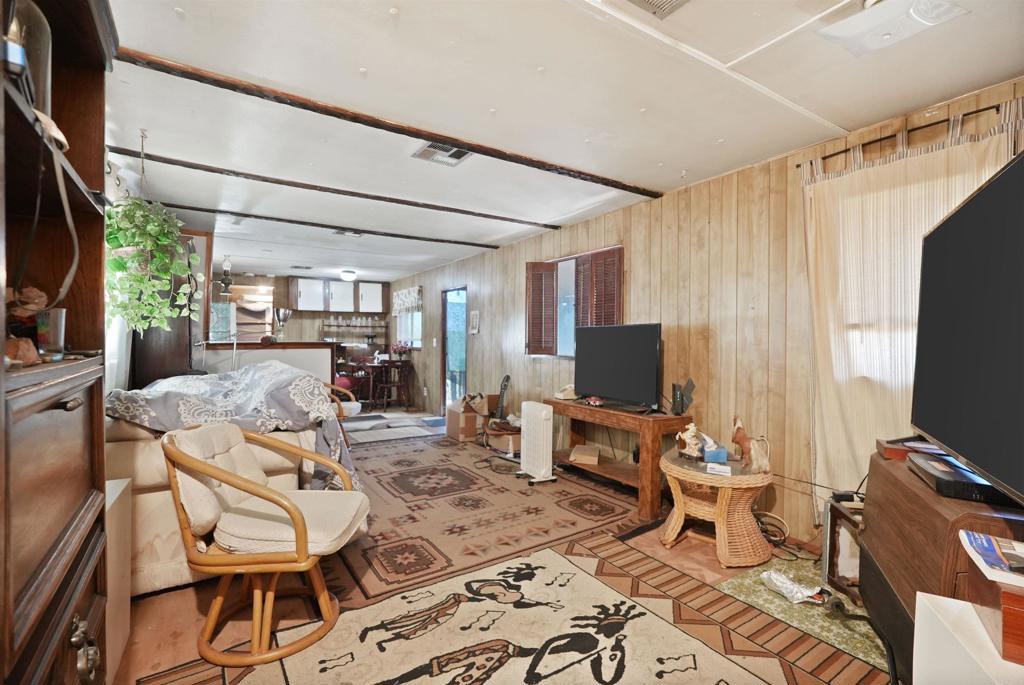 40645 Sage Road Hemet, CA 92544 - Photo 5 of 70 a living room with furniture a flat screen tv and a window