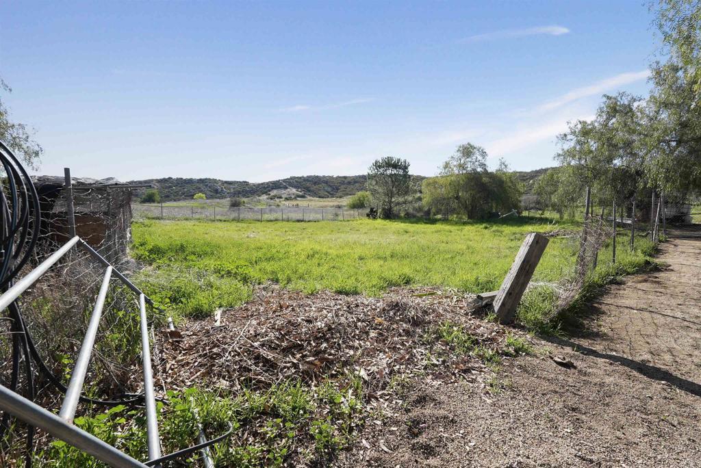 40645 Sage Road Hemet, CA 92544 - Photo 51 of 70 a view of a garden with a wooden bridge