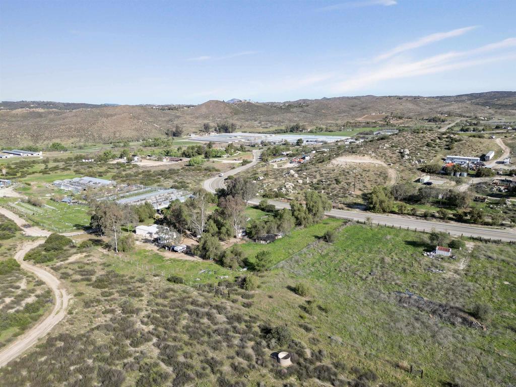 40645 Sage Road Hemet, CA 92544 - Photo 60 of 70 an aerial view of residential houses with outdoor space and trees