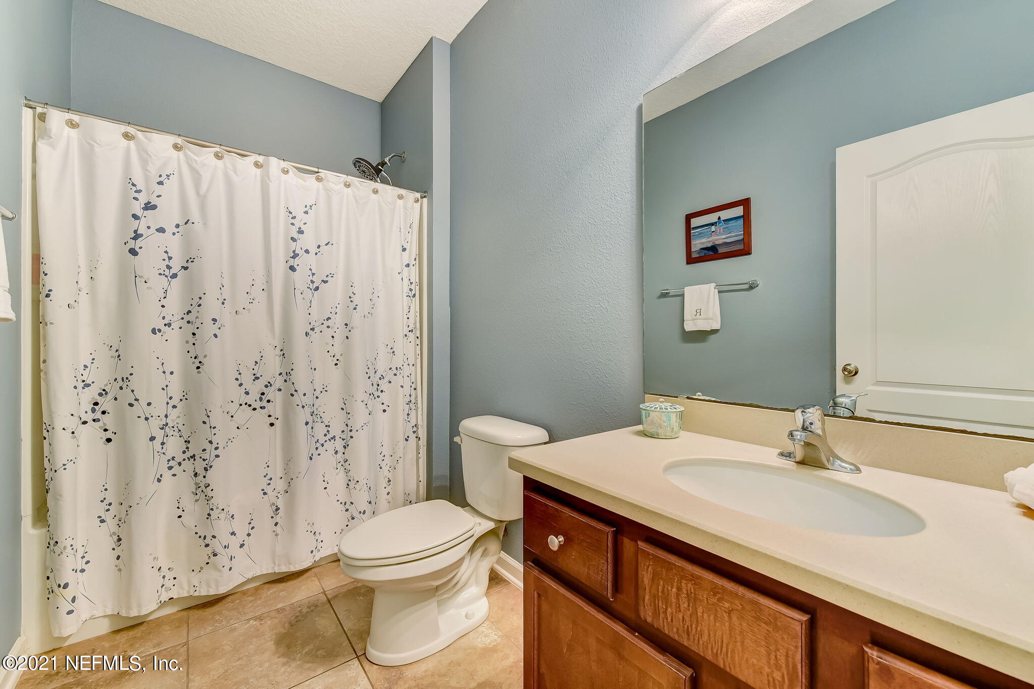 97254 Bluff View Circle Yulee, FL 32097 - Photo 11 of 34 a bathroom with a sink a toilet and shower curtain