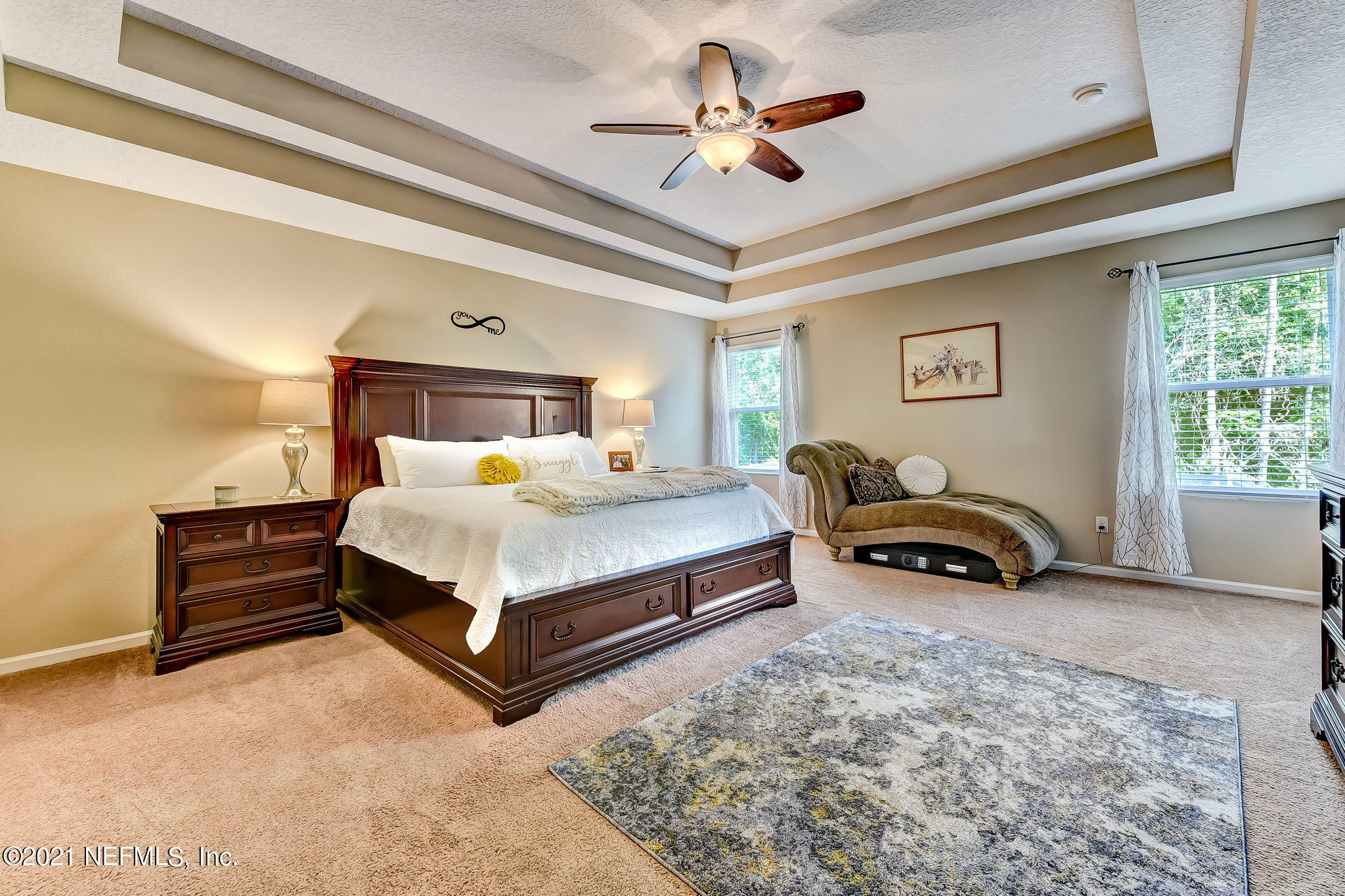 97254 Bluff View Circle Yulee, FL 32097 - Photo 14 of 34 a bedroom with bed and a chandelier