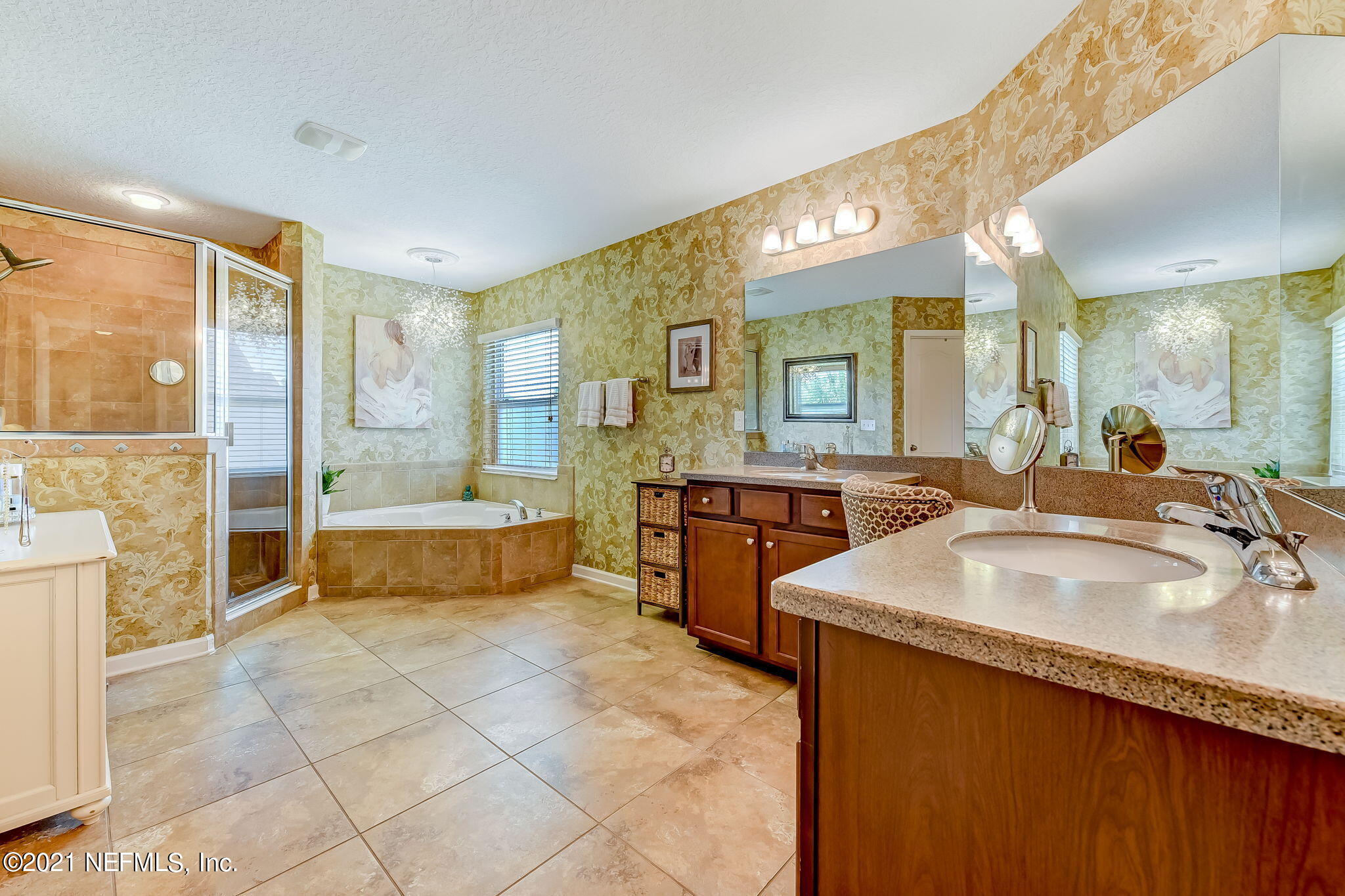 97254 Bluff View Circle Yulee, FL 32097 - Photo 16 of 34 a spacious bathroom with a tub sink and mirror