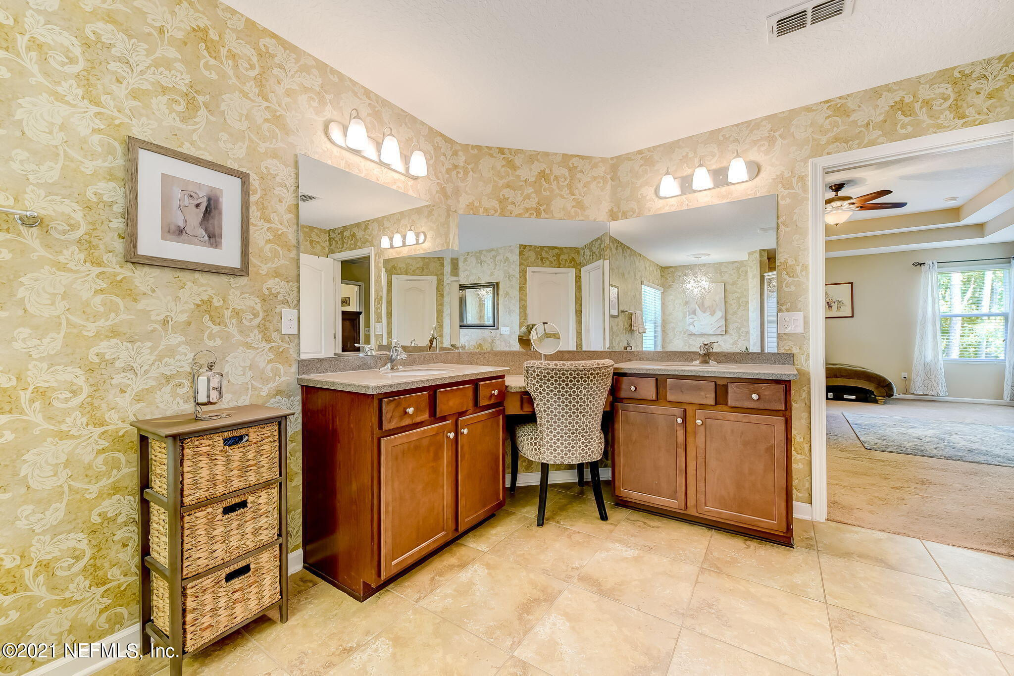 97254 Bluff View Circle Yulee, FL 32097 - Photo 18 of 34 a spacious bathroom with a granite countertop sink mirror and