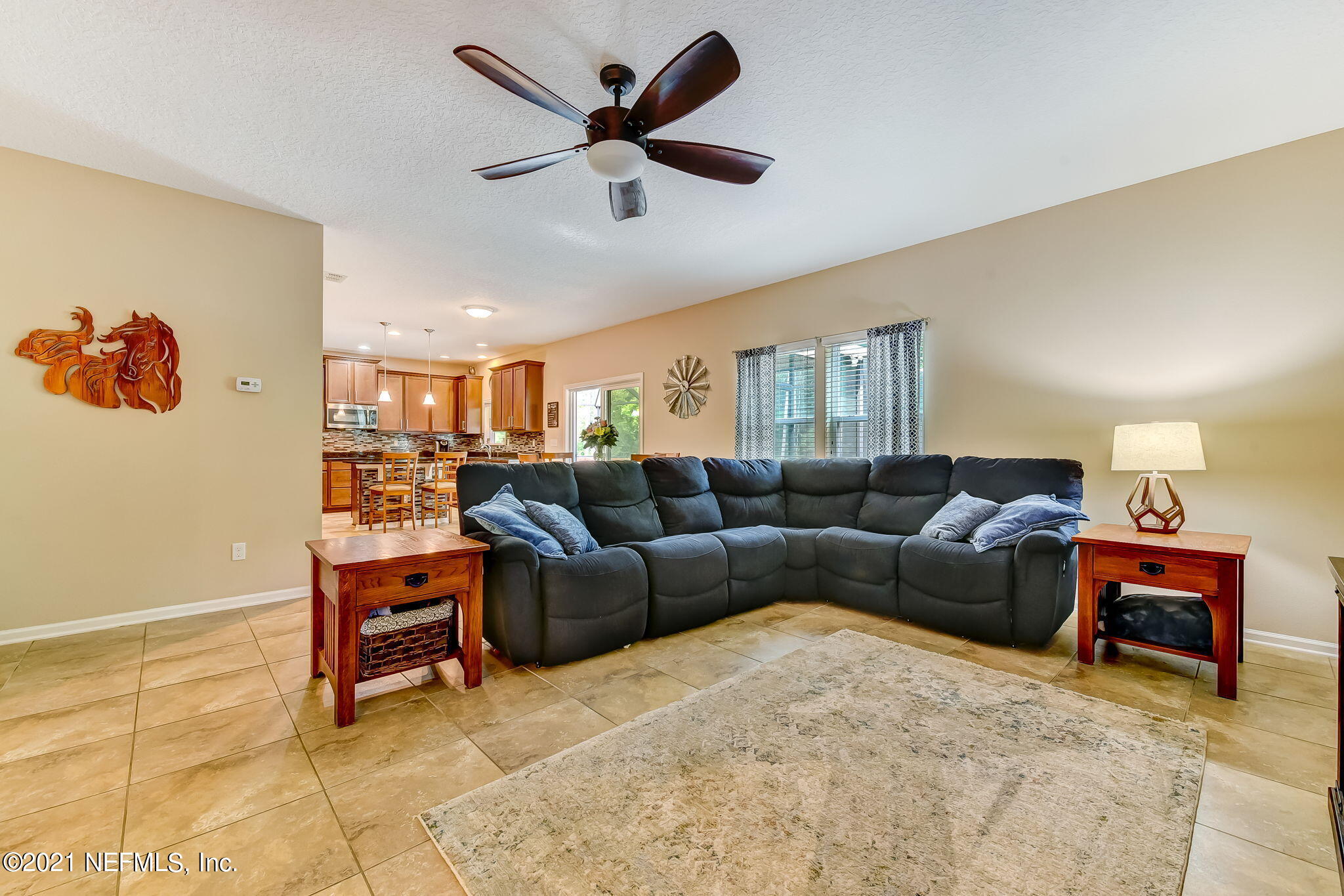97254 Bluff View Circle Yulee, FL 32097 - Photo 2 of 34 a living room with furniture and a ceiling fan