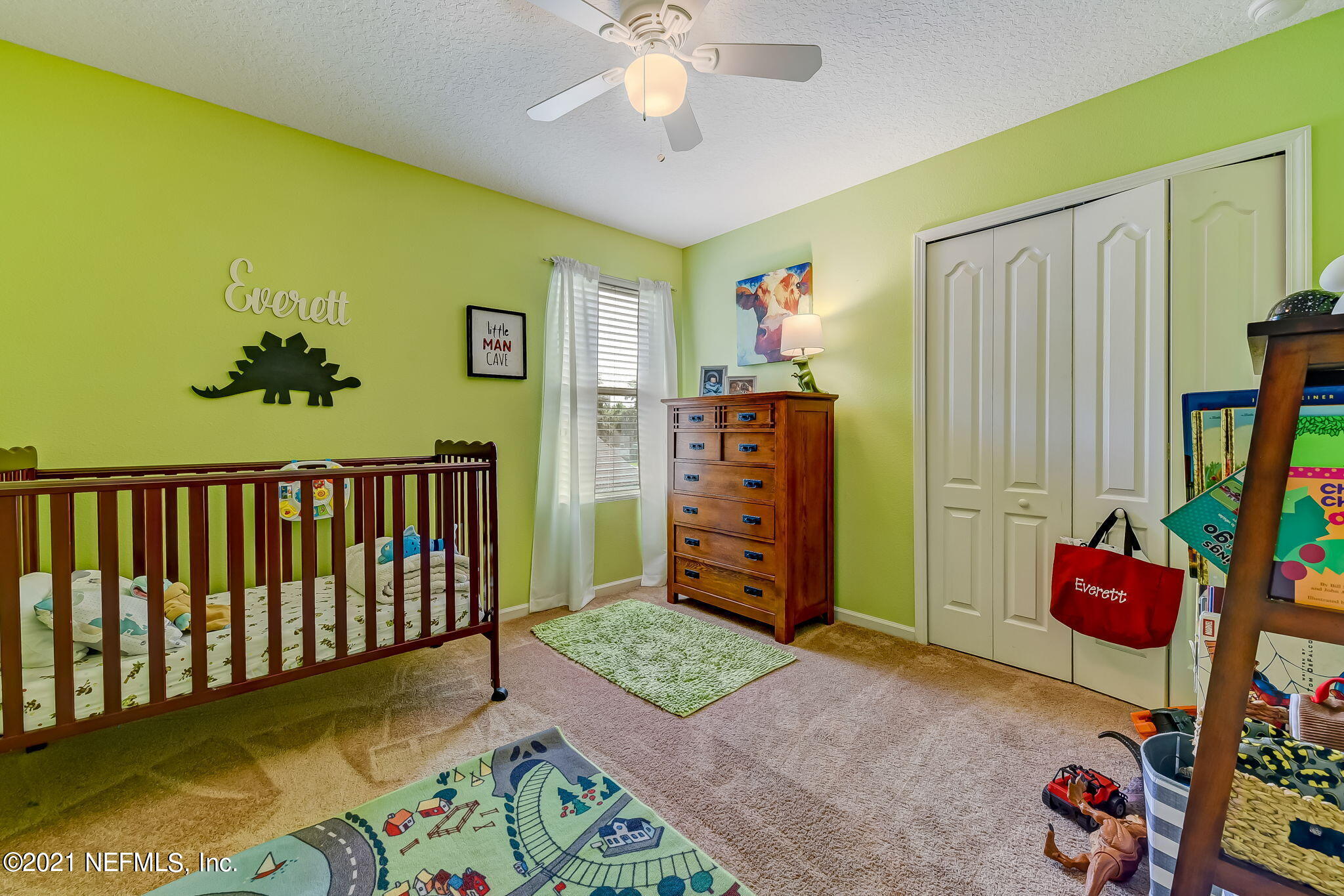 97254 Bluff View Circle Yulee, FL 32097 - Photo 21 of 34 a bedroom with a bed and a window