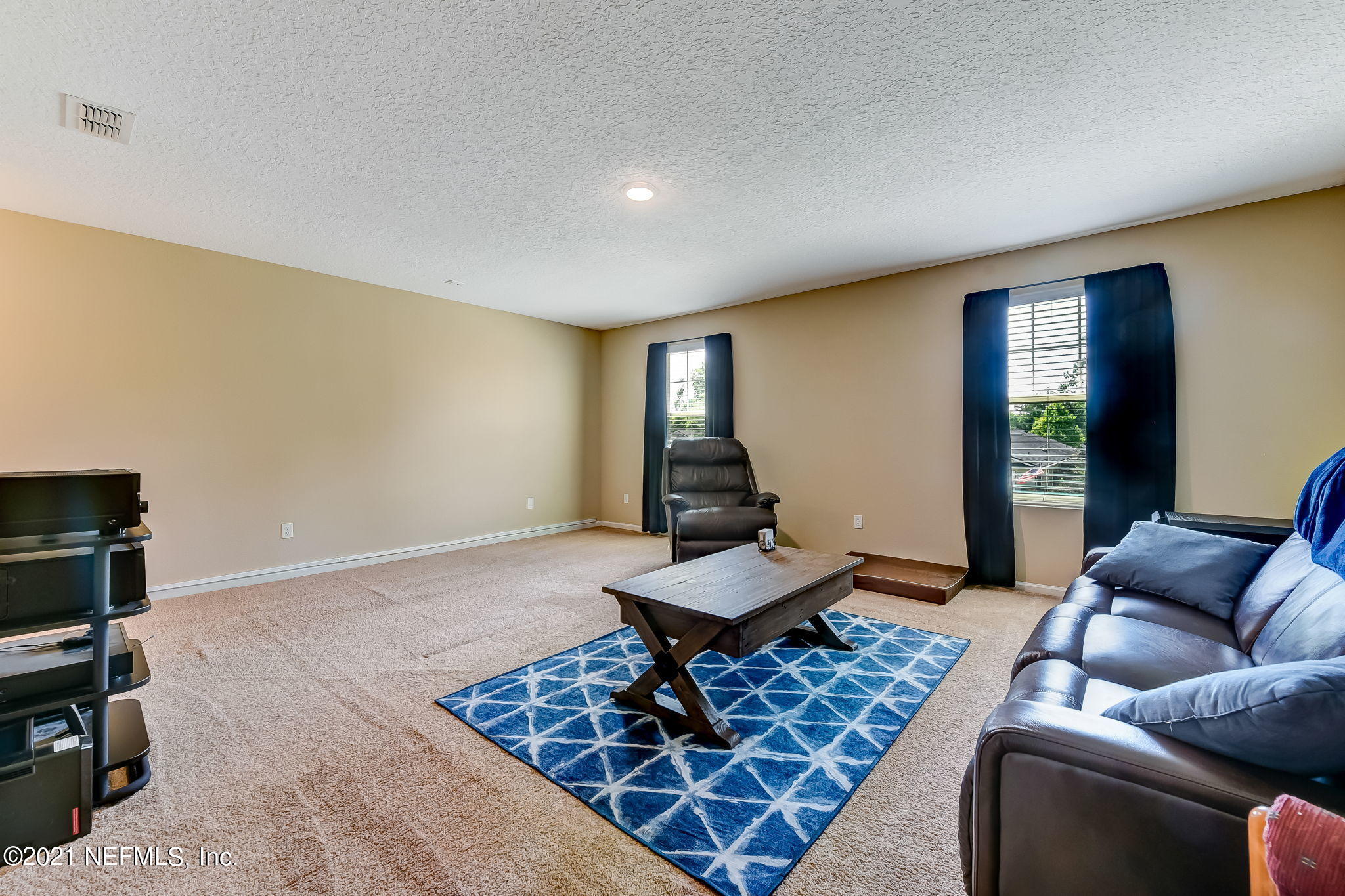 97254 Bluff View Circle Yulee, FL 32097 - Photo 25 of 34 a living room with furniture and wooden floor
