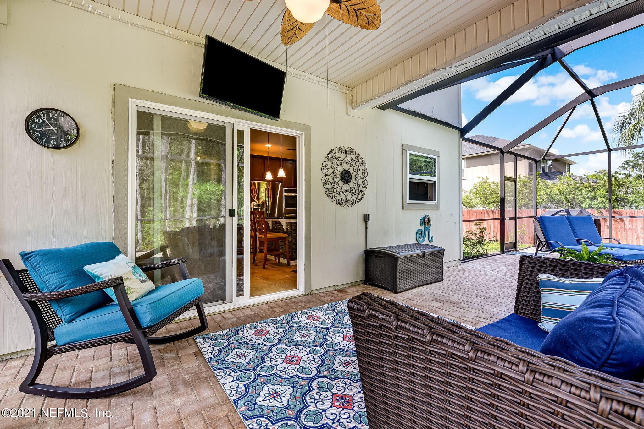97254 Bluff View Circle Yulee, FL 32097 - Photo 26 of 34 a living room with furniture and a flat screen tv