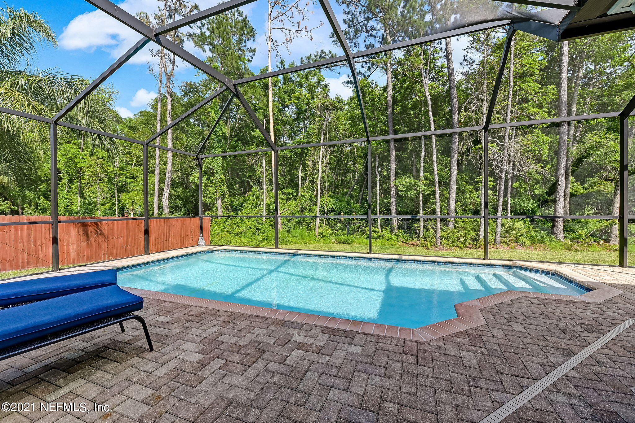 97254 Bluff View Circle Yulee, FL 32097 - Photo 30 of 34 a view of a backyard with a small pool