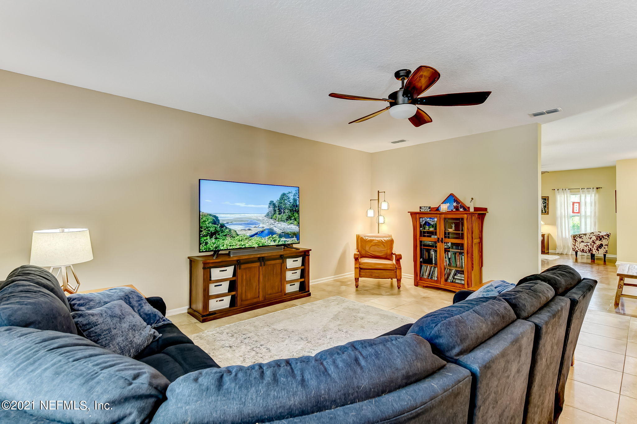 97254 Bluff View Circle Yulee, FL 32097 - Photo 3 of 34 a living room with furniture and a flat screen tv