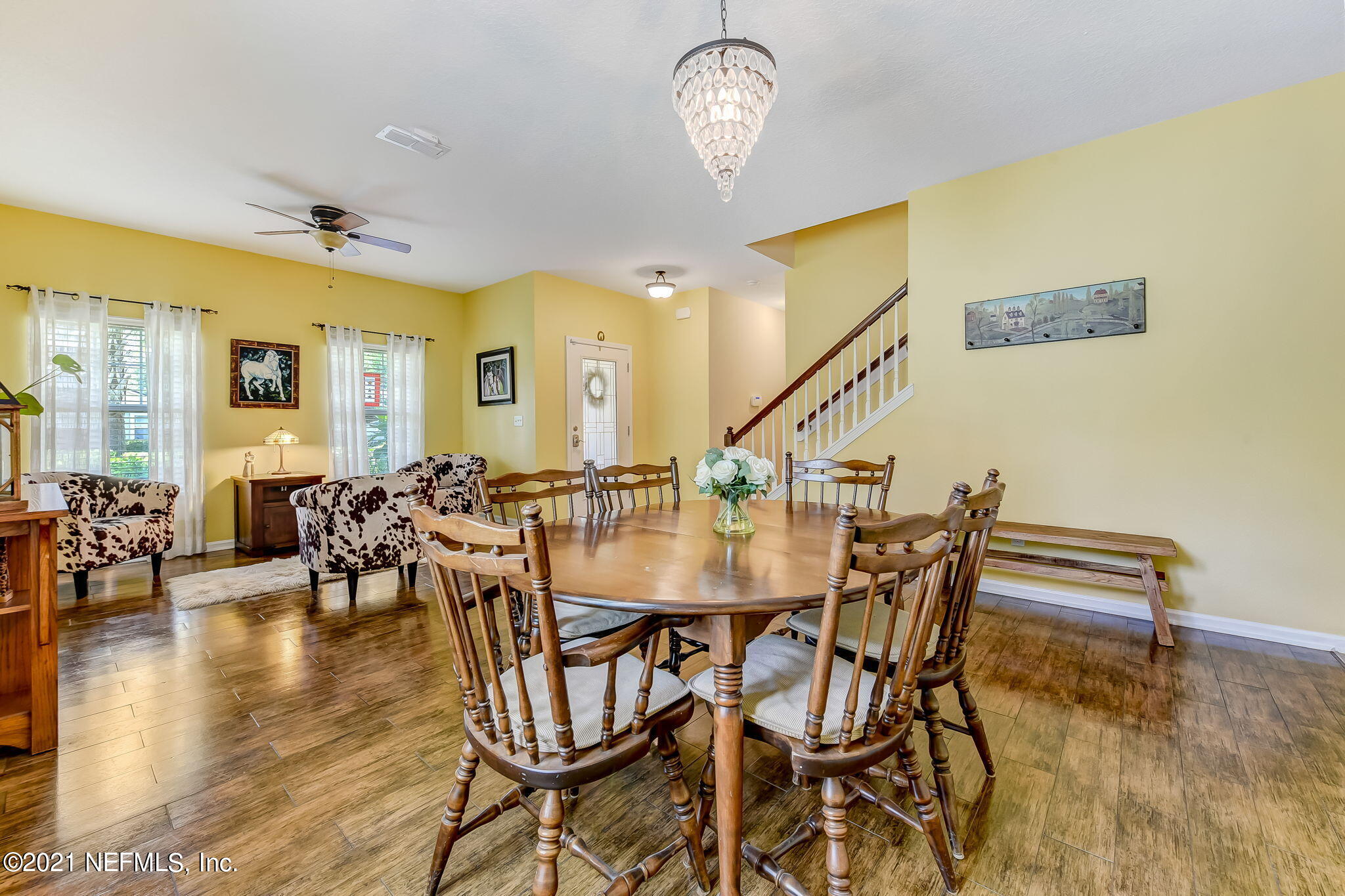 97254 Bluff View Circle Yulee, FL 32097 - Photo 4 of 34 a view of a dining room with furniture and wooden floor