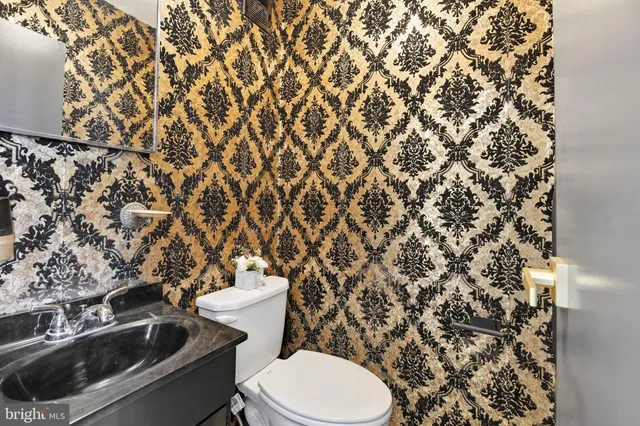 a bathroom with a toilet and a sink