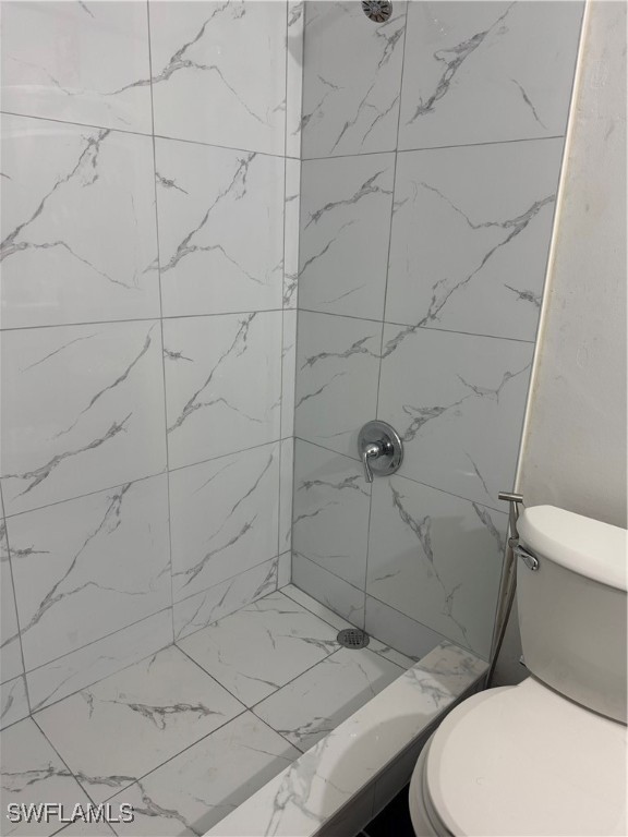 806 West 80th Place Hialeah, FL 33014 - Photo 13 of 17 a white toilet and shower in a bathroom
