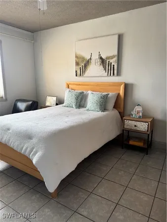 a bedroom with a bed and cabinets