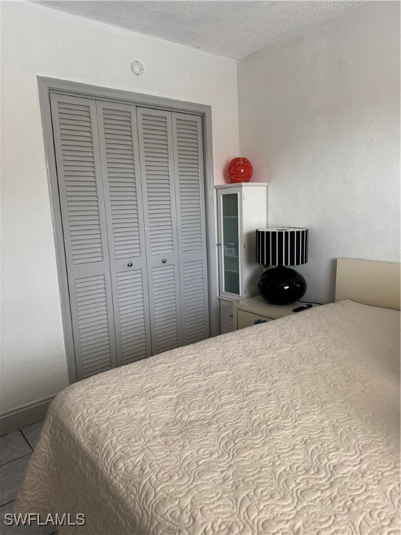 806 West 80th Place Hialeah, FL 33014 - Photo 10 of 17 a bedroom with a bed and cabinets