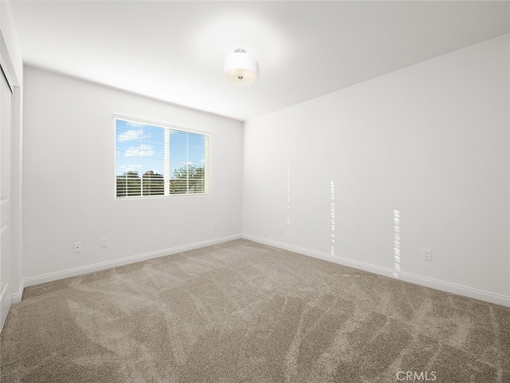 1325 West Grand Avenue, Unit 3 Pomona, CA 91766 - Photo 13 of 30 an empty room with windows